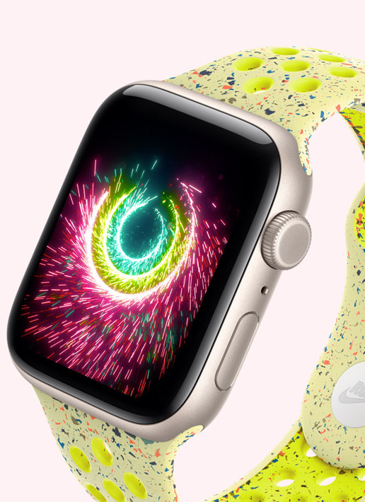 Apple Watch SE 3, aluminium case, starlight colour, Activity rings sparking like fireworks, volt splash Nike Sport Band