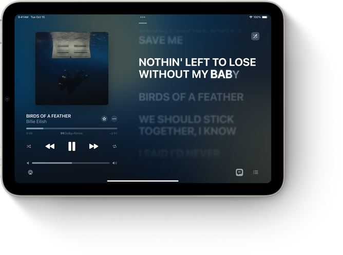 iPad mini, хоризонтална ориентация, показващ Apple Music с текст на песен.