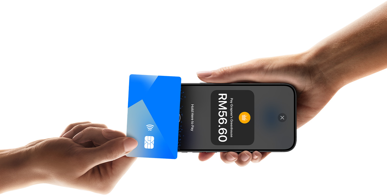 An image of a hand tapping a credit card on an iPhone device that another person is holding, with the iPhone’s screen showing transaction information.
