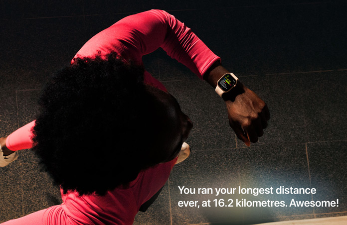 Photo of a man using his Apple Watch to track his run