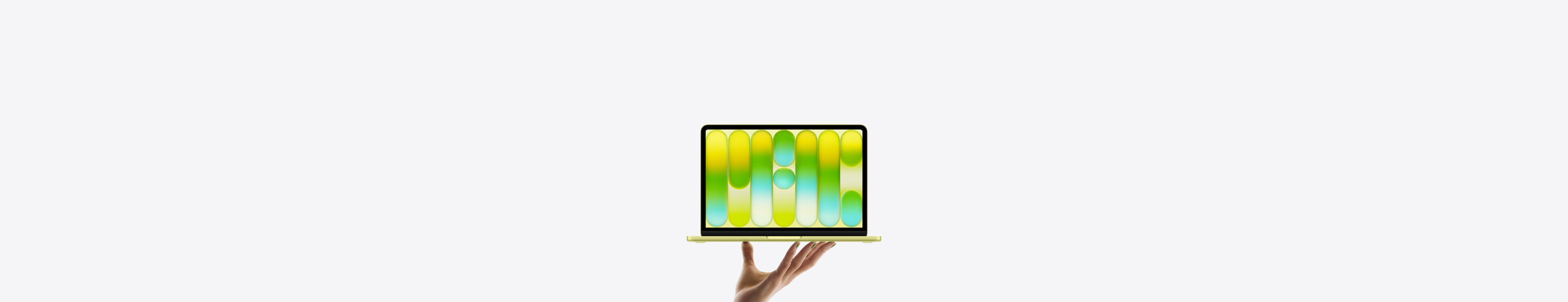 MacBook Neo en un brillante color amarillo cítrico, sostenido en equilibrio en la punta de los dedos de una mano abierta, la pantalla muestra un patrón abstracto y colorido